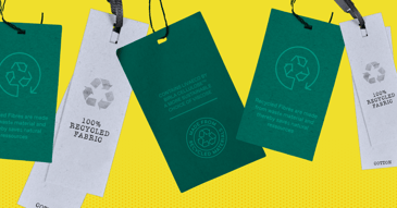 Recycled materials clothing tags on a yellow background.