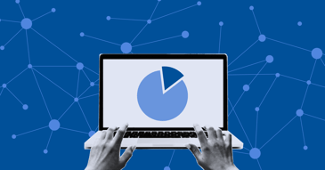 A computer with a pie chart on the screen against the blue background.