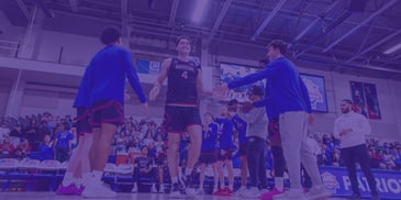 Lincoln Ball of the American University men's basketball team with teammates