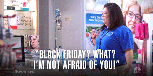a woman working retail with the caption saying 'Black Friday? what? I'm not afraid of you!'