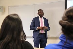 Brice Ngameni speaking in class.