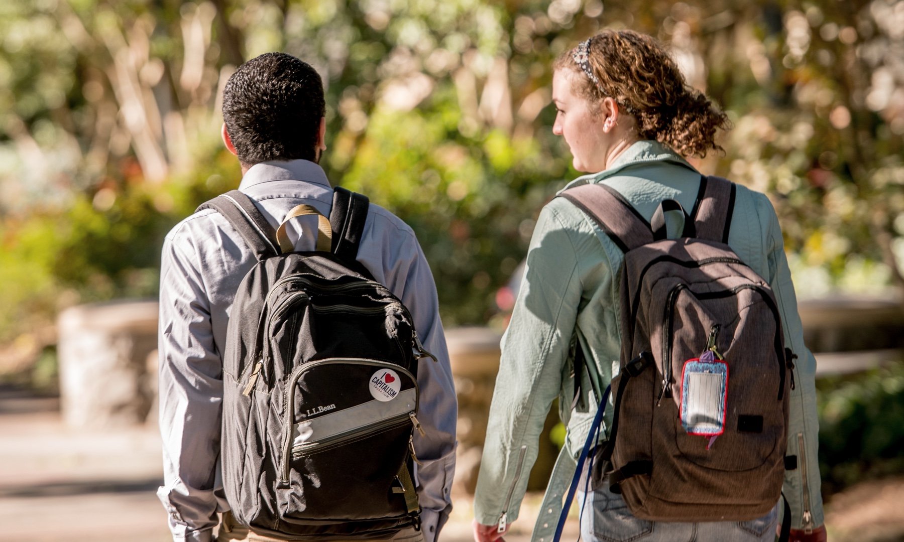 Two students walking on campus together