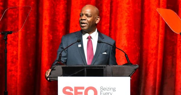 William Goodloe speaking at a podium.