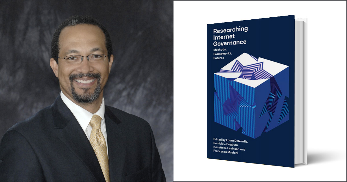 Professor Derrick Cogburn with the book he coauthored, Researching Internet Governance: Methods, Frameworks, Futures